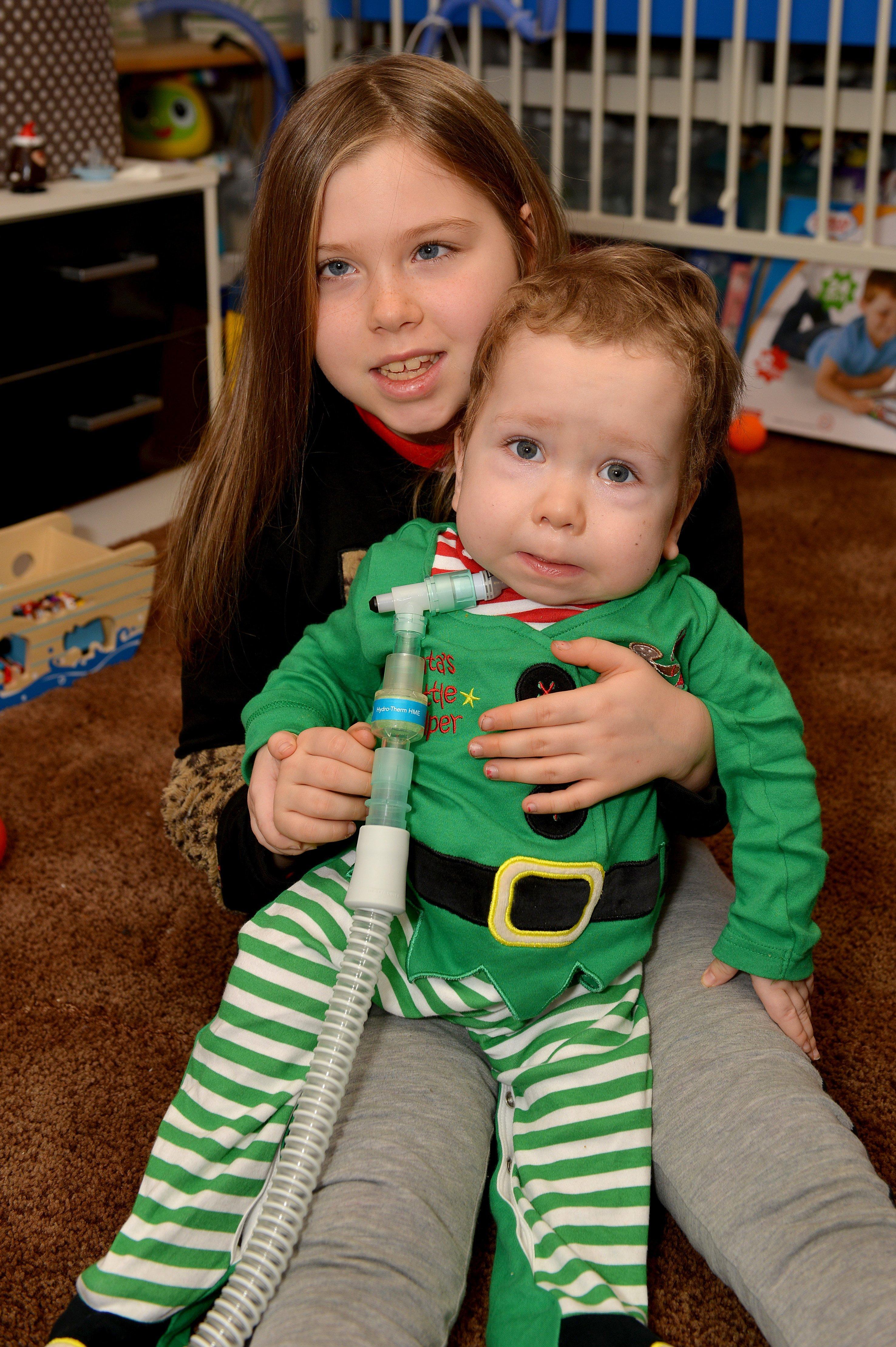 Tommy, aged two-and-a-half, with his eight-year-old sister Kadie.