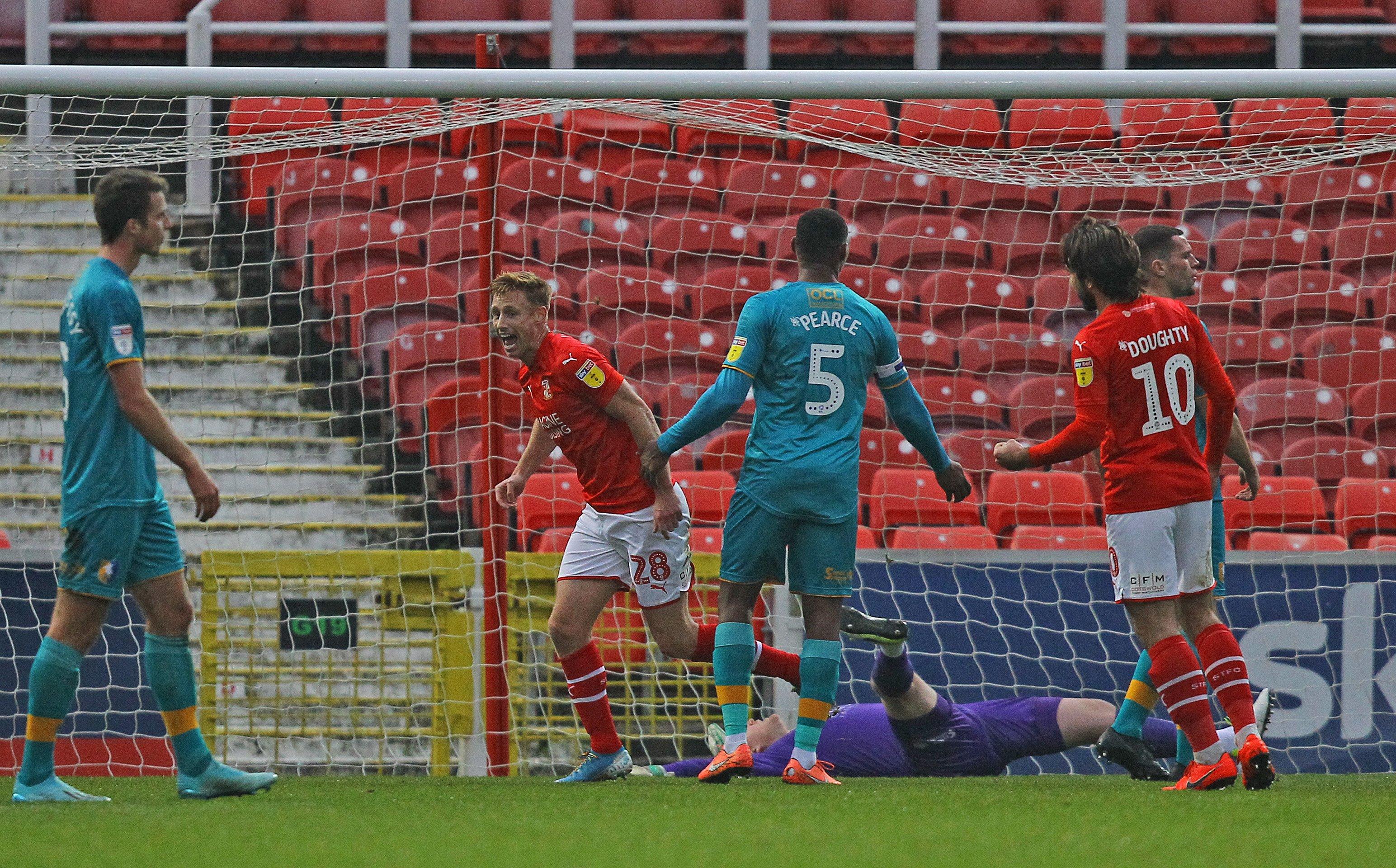 Eoin Doyle celebrates after giving Swindon the lead against Mansfield.