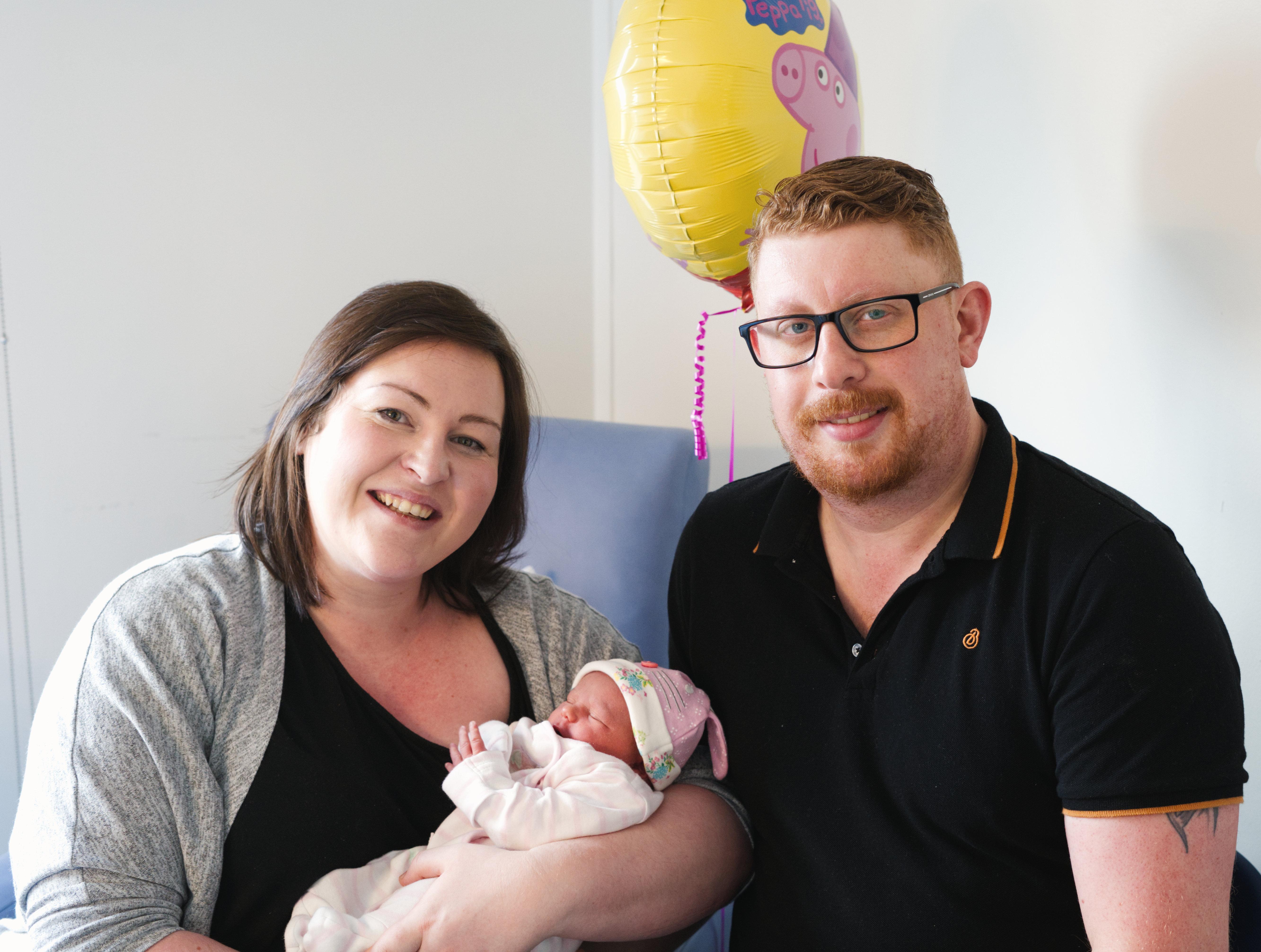 Emma Evans with partner George Evans and baby Rosie.