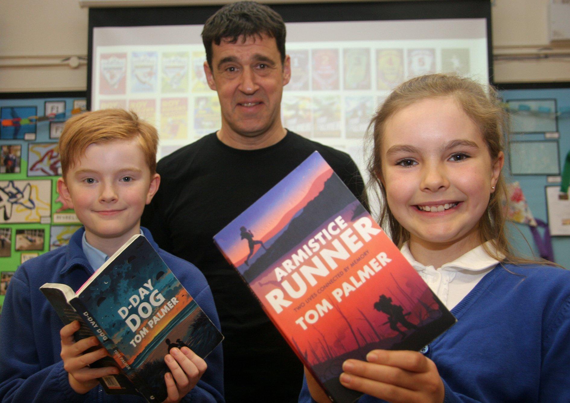 Pupils Arthur Cheshire and Annabel Harwood meet author Tom Palmer.