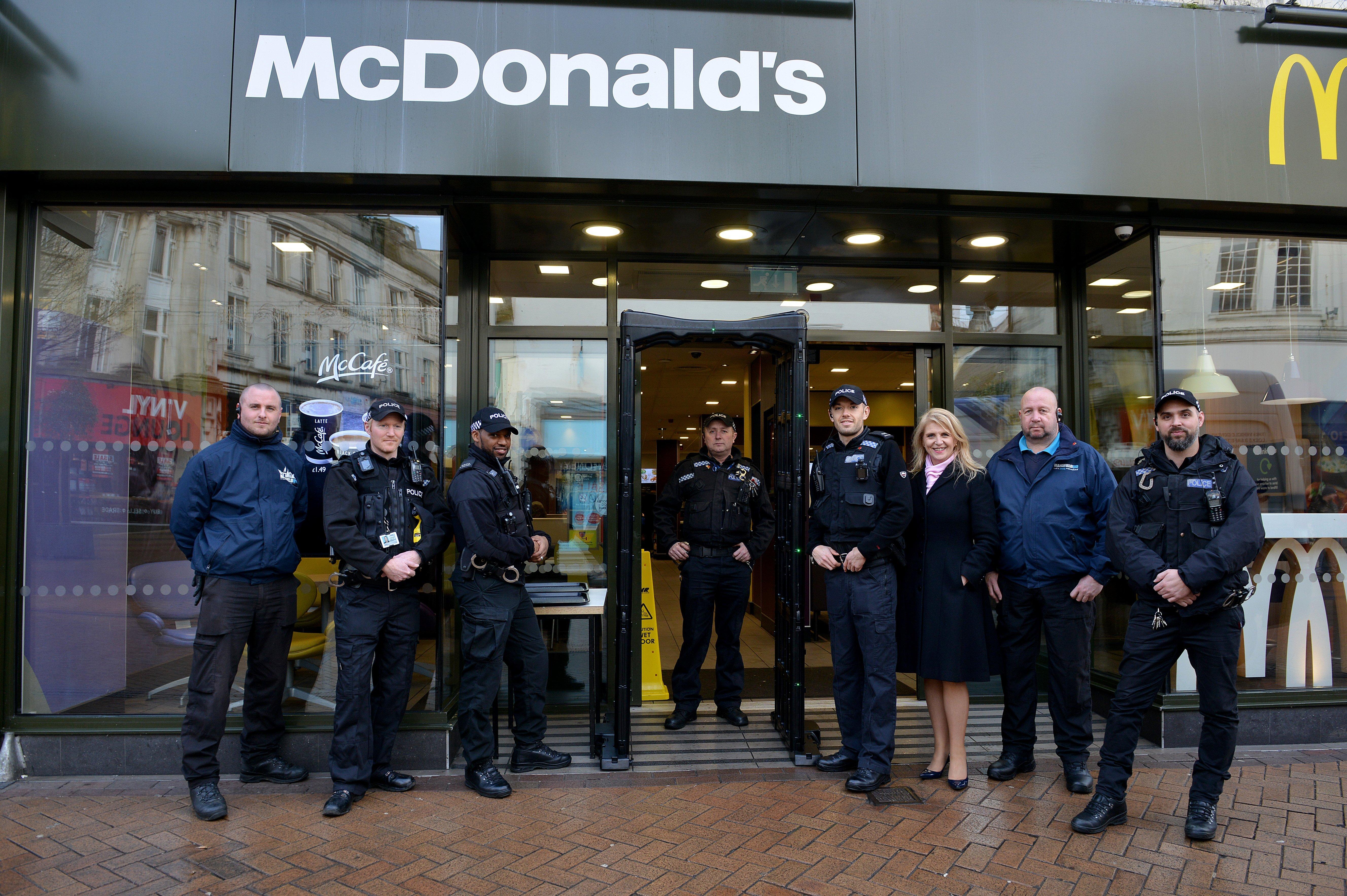 McDonald's and Mansfield business improvement district staff join police officers with the knife arch outside McDonald's.