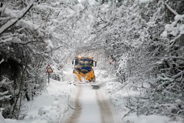 Tayside Contracts plough driver Iain Beedie clears rural roads in Perthshire on December 3, 2010 in Perth, Scotland. (Photo by Jeff J Mitchell/Getty Images)