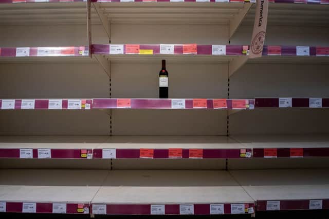 One bottle of shiraz red wine is left for sale on emptied shelves at a Sainsburys supermarket (Photo: Chris J Ratcliffe/Getty Images)