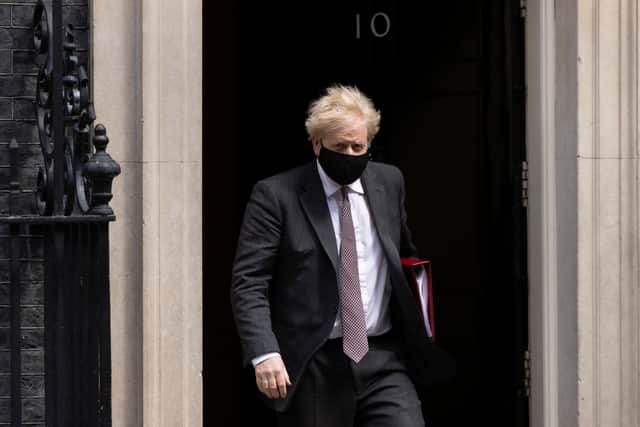 Prime Minister Boris Johnson leaves 10 Downing Street to attend the weekly Prime Ministers Questions in Parliament on April 21 (Photo by Dan Kitwood/Getty Images)