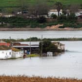Houses in the middle of a flooded area after Storm Laurence passed through El Palmar de Troya in southern Spain, before Martinho swept in.