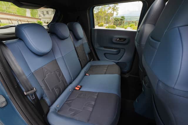 Rear passengers have plenty of room, and I like the phone pockets at the top of the seats