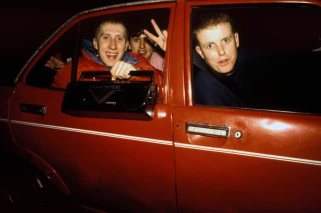Ravers show off their boombox in the early 90s. This one was minuscule compared to some of the beasts you saw back then.