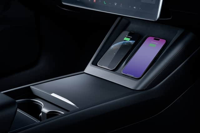 The cabin still has lots of cool touches - like the dual smartphone charging stand