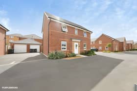 The detached Mansfield home occupies a cul-de-sac position with a private driveway
