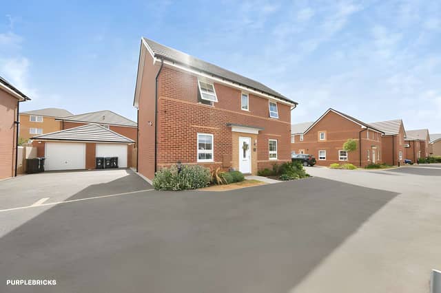 The detached Mansfield home occupies a cul-de-sac position with a private driveway