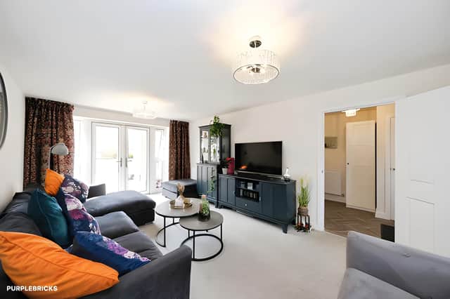 Three reception rooms give the home a flexible arrangement for family life