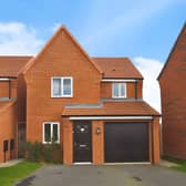 The detached Mansfield home has a driveway and integral garage, providing practical off-street parking at the front