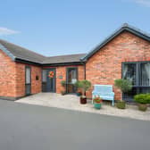 The detached bungalow occupies a private estate setting in Forest Town, with a driveway and garage adding practical features