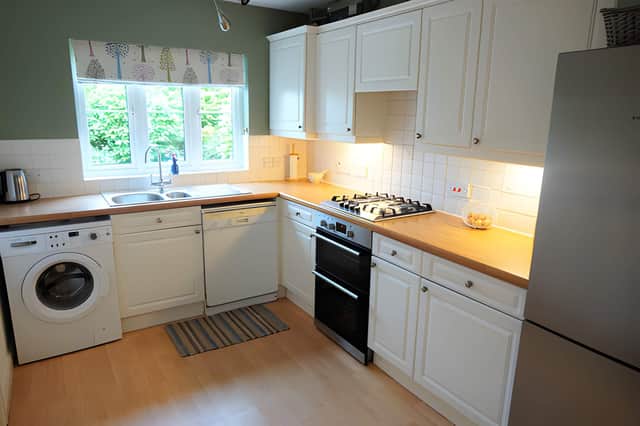The separate fitted breakfast kitchen offers practical everyday space, with potential for buyers to consider a more modern layout in the future.