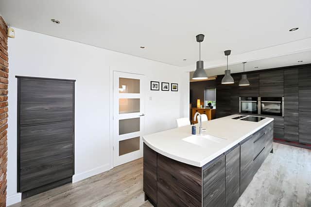 The kitchen is among the home's central living spaces, combining practical everyday use with the property's contemporary finish.