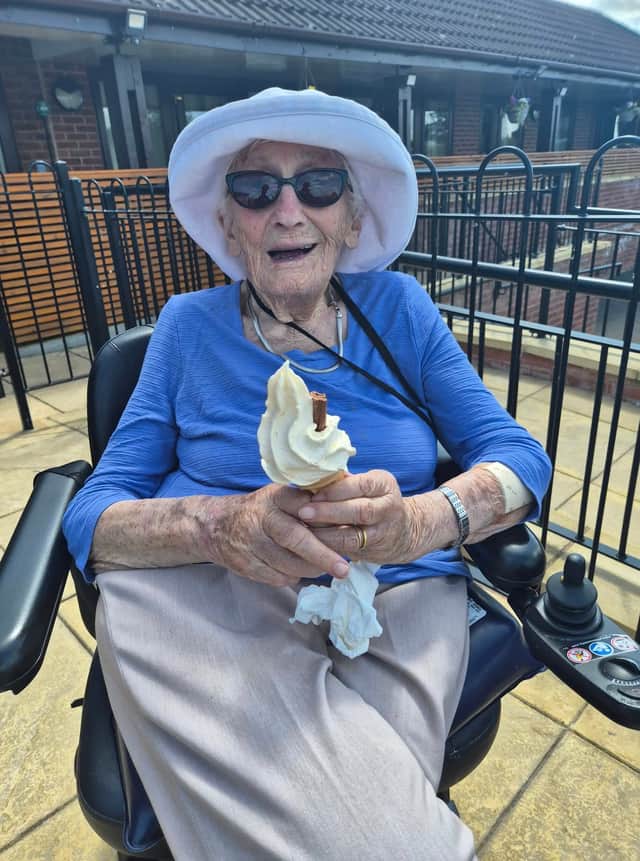 One of the care home residents keeping cool outside
