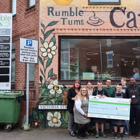 The Barratt team handing the cheque to the team at Rumbletums.