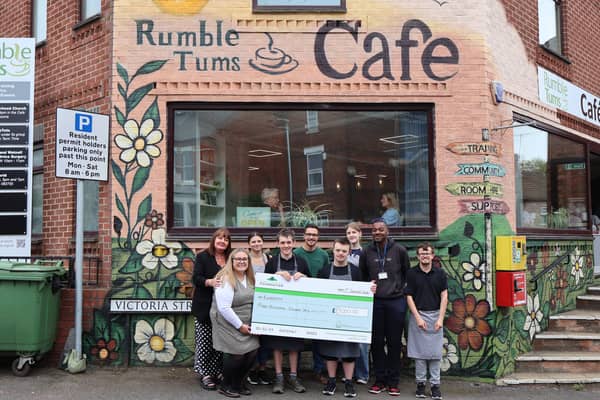 The Barratt team handing the cheque to the team at Rumbletums.