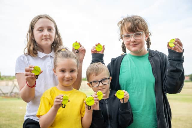 Pupils at The Flying High Academy Ladybrook showing off their donated bag tags