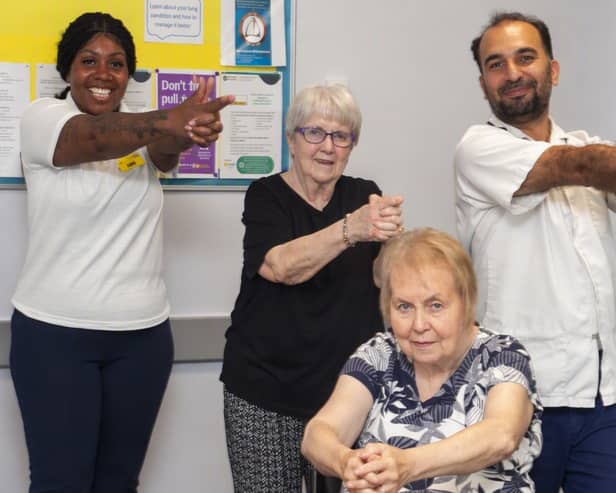 Practitioners Gellian and Hasan supporting people with Parkinson’s