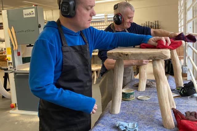 Team members get to work in the workshop