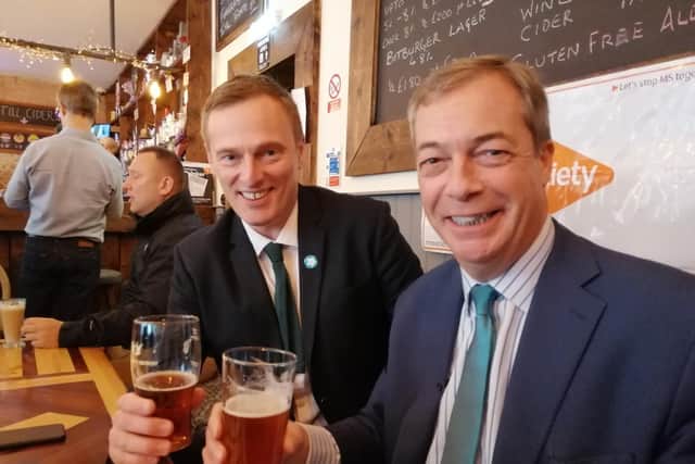 Nigel Farage and Brexit Party candidate for Ashfield, Martin Daubney, share a pint in the Dog and Parrot pub in Eastwood.
