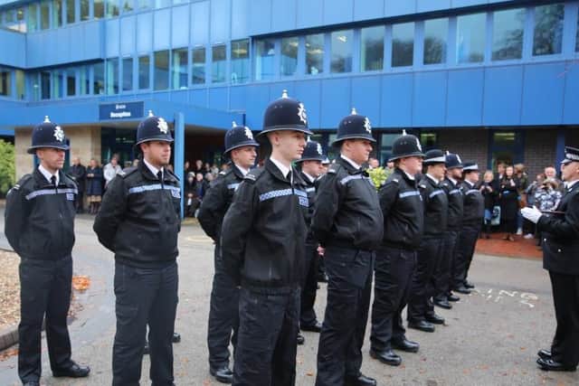 The new officers passing out at force HQ.