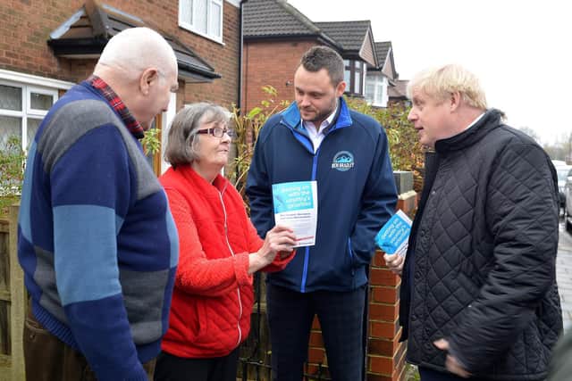 Boris Johnson and Ben Bradley speaking with residents in Mansfield.
