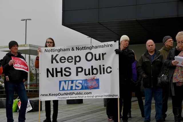 Protesters call for the NHS to remain in public ownership ahead of the general election next month.