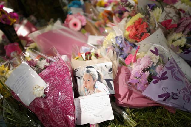 Flowers and tributes lay at the scene in Westfield Lane