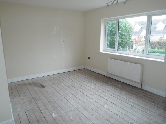 This bedroom has a view over the front garden and street.