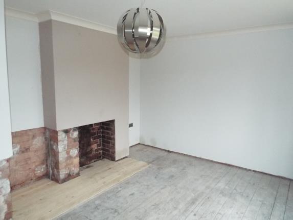 The house requires a refurbishment, but has features like this fireplace in the lounge.