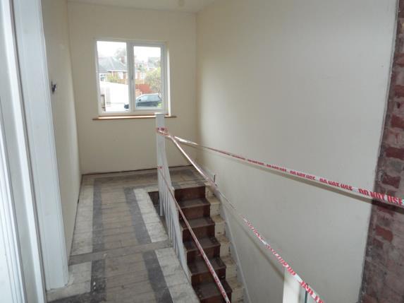 The landing leads to the two bedrooms and a bathroom.