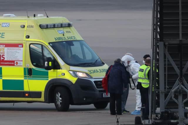 NHS staff wearing protective gear (photo: Steve Parsons / PA Wire).