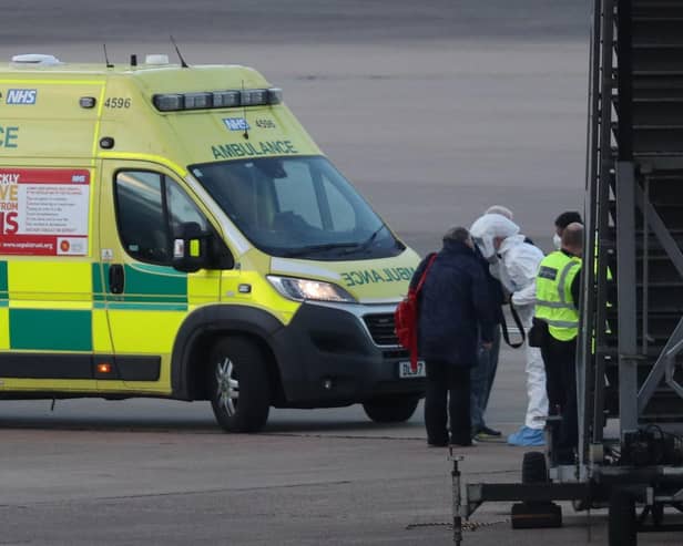 NHS staff wearing protective gear (photo: Steve Parsons / PA Wire).