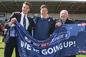 Wigan Athletic chairman David Sharpe (left), manager Gary Caldwell and owner Dave Whelan celebrate promotion to the Championship in 2016. Photo: GettyImages