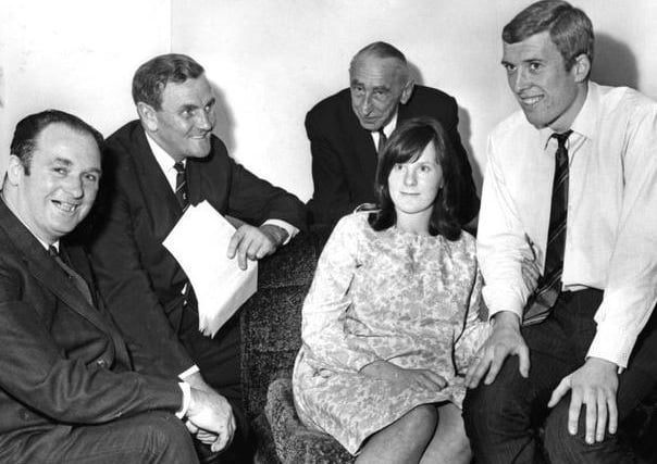 Mick Jones signs for Leeds in September 1967 with Don Revie second from left.