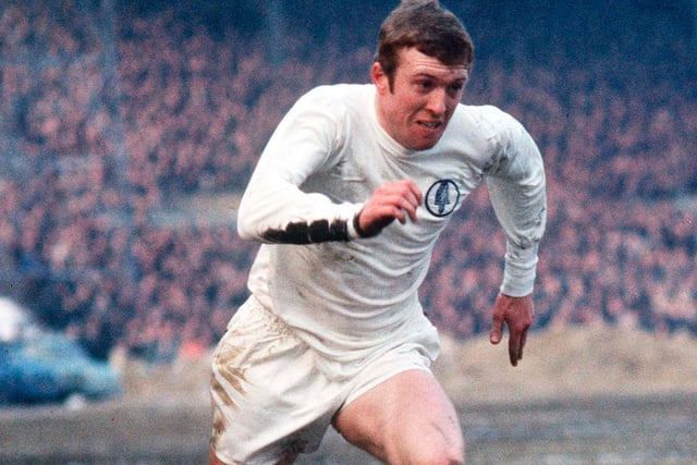 Mick Jones drives forward on a snowy Elland Road pitch in 1970.
