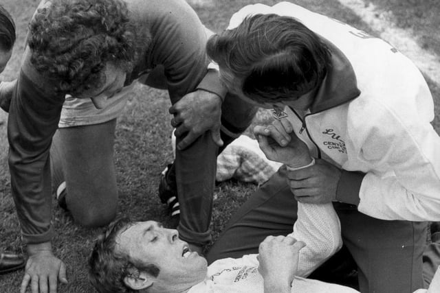 Mick Jones is treated by trainer Les Cocker after colliding with Arsenal goalkeeper Geoff Barnett (pictured) during the last few minutes of the 1972 FA Cup final.