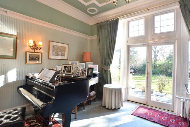 There are three reception rooms in the house - complete with a stunning piano.