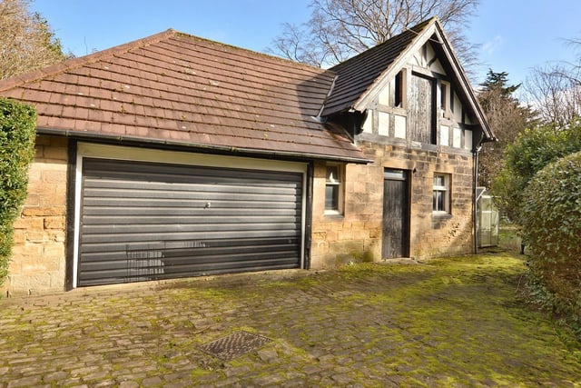 There is a detached double garage and stable block