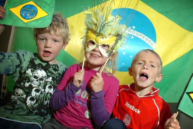 Enjoying the fun during the Brazil themed events at the National Football Museum in Preston, Ben, six and Isobel Sanders, eight and Josh Wolfe, seven, from Penwortham