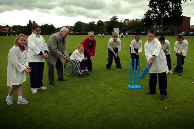 Sir Tom Finney joins in the action during the Preston Schools Cricket Taster day at Preston Cricket Club