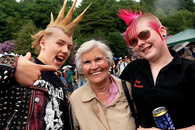 Punk pensioner, Eveline Laughton, joins in the fun with Elliot Morris, left, and April Fillingham, right, at Haigh Music Festival on Sunday 18th of June 2006.