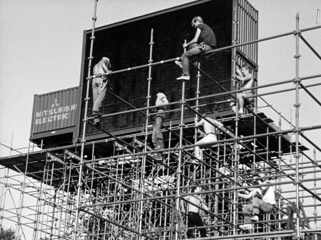 Roadies put up the main stage ahead of the concert.