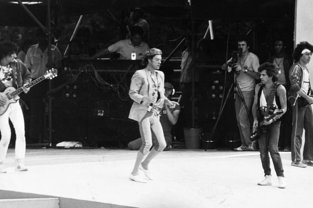 Mick Jagger and the band strut their stuff on a giant stage.