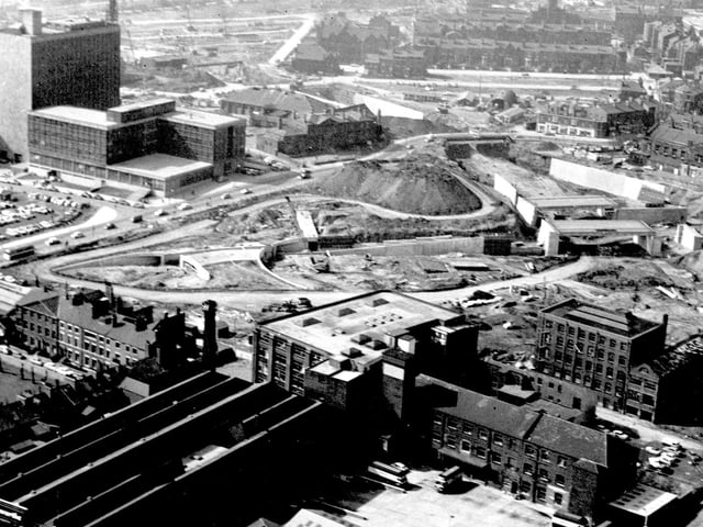 Construction of the Leeds Inner Ring Road in April 1965. The large building in the foreground is the premises of J. Hepworth and Son Ltd., manufacturing clothes, their own goods vehicles can be seen in the yard