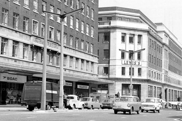 The Headrow from the junction with Albion Street. To the left is Headrow House with shops on the ground floor including B.O.A.C. and Vallance's radio and television engineers.