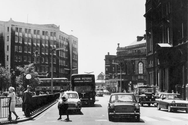 Infirmary Street across City Square before the site was redeveloped following the closure of the road seen in the foreground which ran between the square itself, seen on the left, and the General Post Office Building.