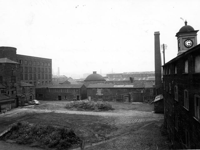 A view of the inner courtyard of Bean Ing Mills, looking west. The buildings were constructed around a quadrangle. Pictured in July 1963